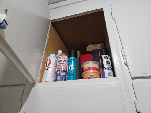 dip sauce alongside air dusters and isopropyl alcohol spray cans